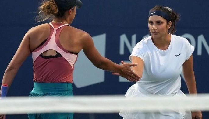 Sania Mirza Sania Mirza is seen gesturing to her partner at a tennis game
